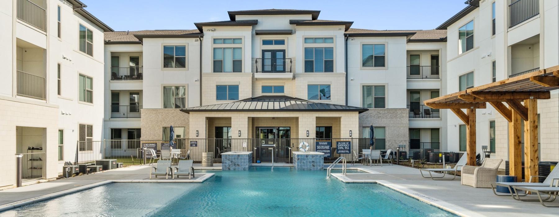 a pool in a large courtyard