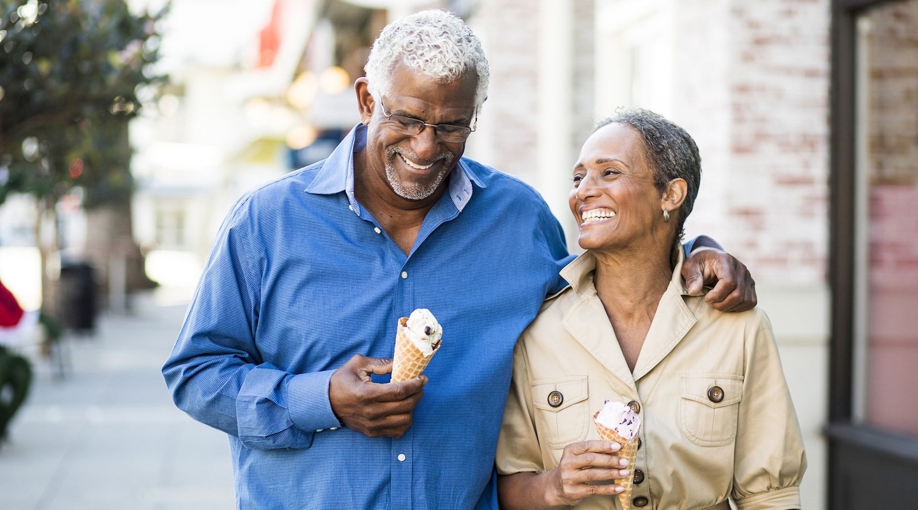 a couple walking and having ice cream