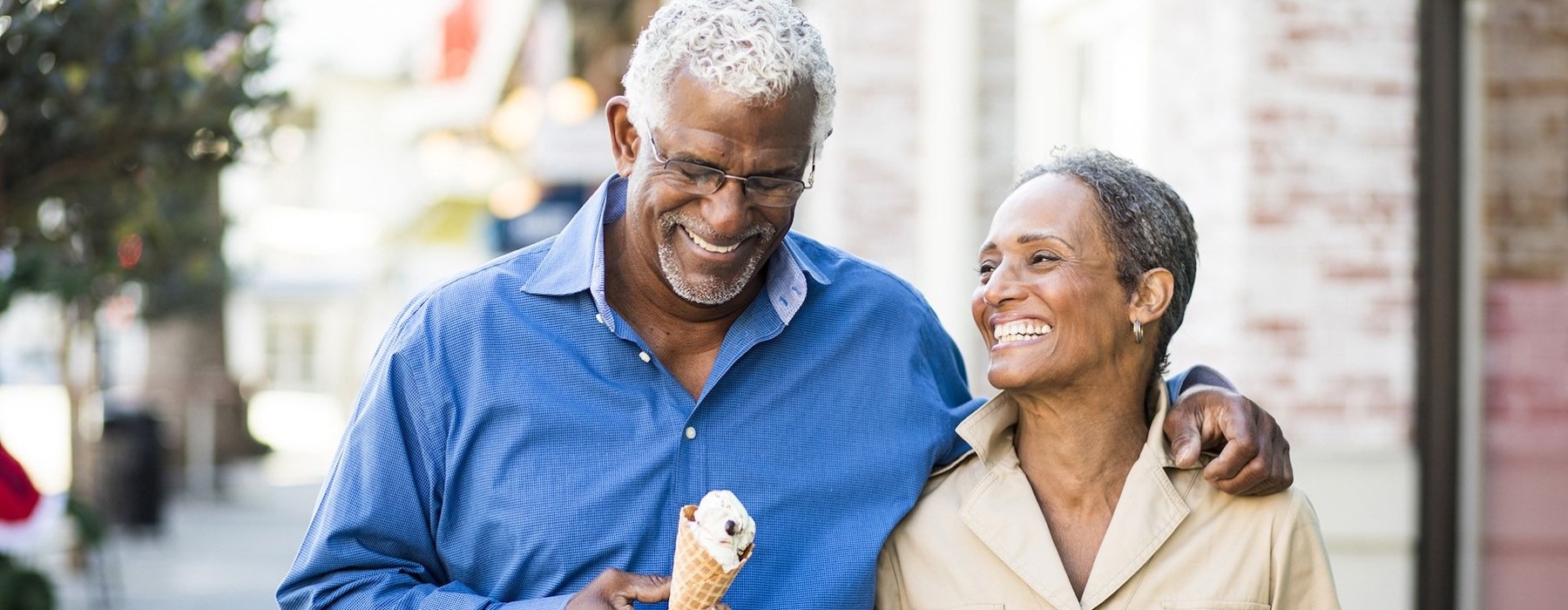 a couple walking and having ice cream